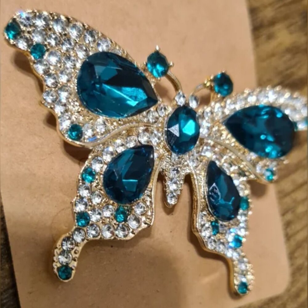 Elegant Butterfly Brooch with Green and Gold Accents.